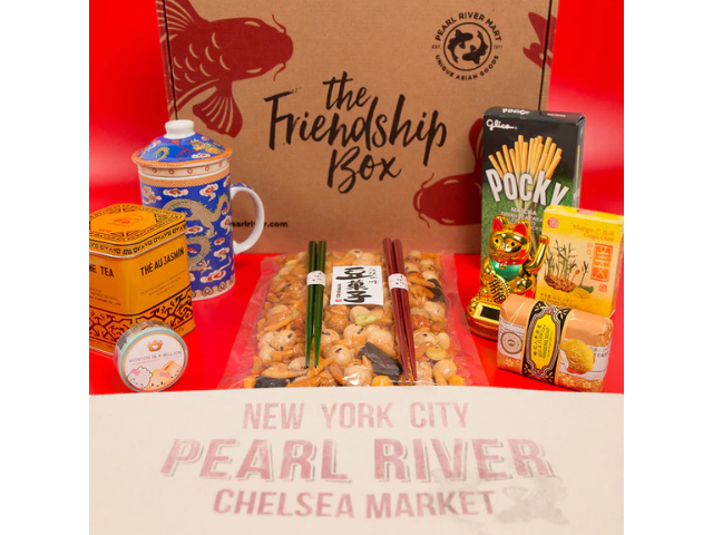 Friendship Box, jasmine tea, blue and white tea mug, Pocky, Bee and Flower soap, and other snacks