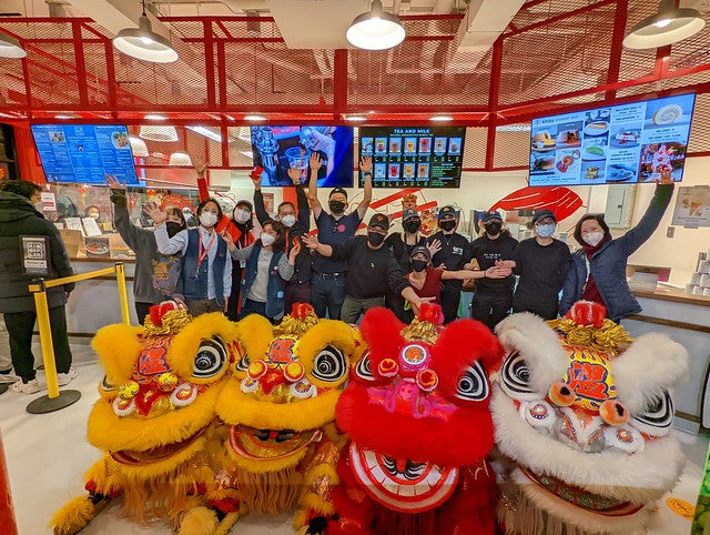 Pearl River Mart staff with lion dancers