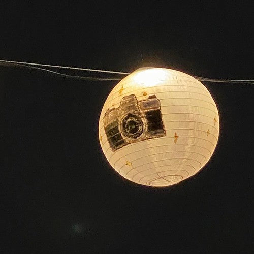 Lantern painted with camera, a dedication to photographer Corky Lee