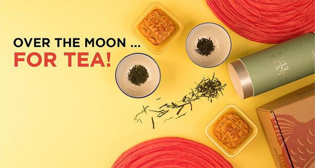Mooncakes with tea cups, tea leaves, and red lanterns
