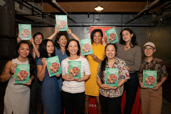 Group of women with Vibrant Hong Kong Table cookbooks at book launch party