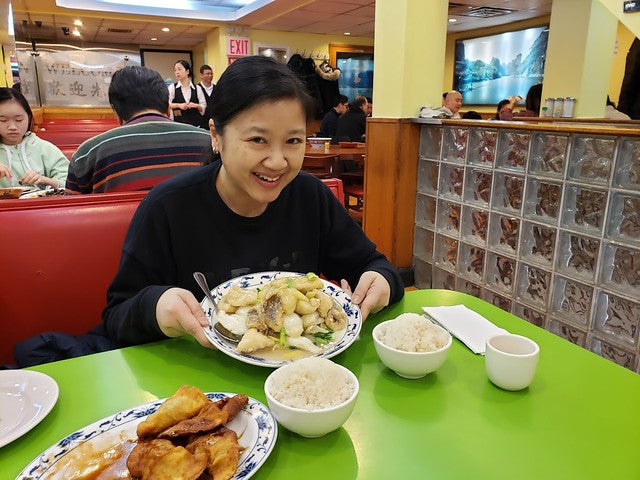 Joanne Kwong enjoying fried flounder at Wo Hop