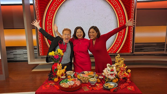 John Elliott, Joanne Kwong, and Cindy Hsu at CBS studios in front Lunar New Year table