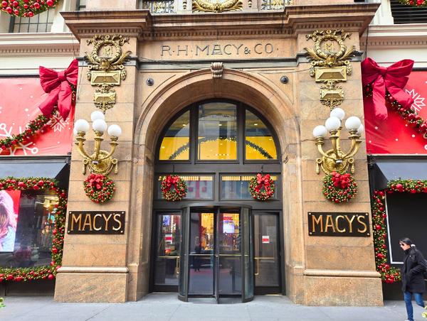 Exterior of Macy's Herald Square decorated with holiday decorations