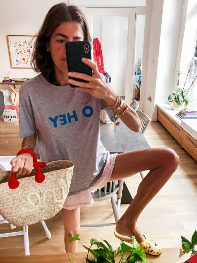 Man Repeller founder, Leandra Medine Cohen, taking a selfie with Pearl River's gold crane slippers