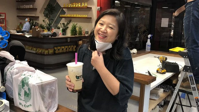 Pearl River Mart President Joanne Kwong enjoying a boba tea