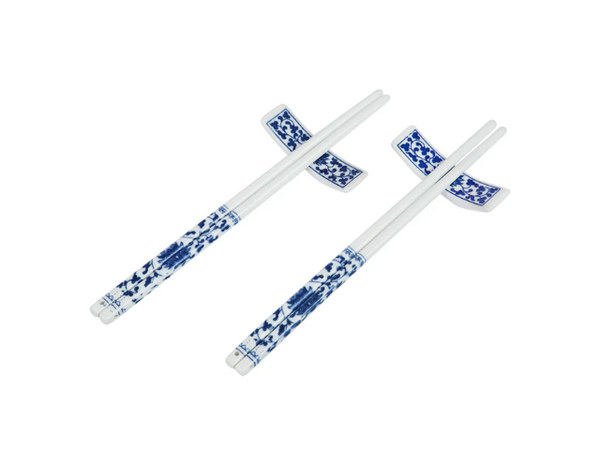 Two pairs of blue on white floral porcelain chopsticks on holders