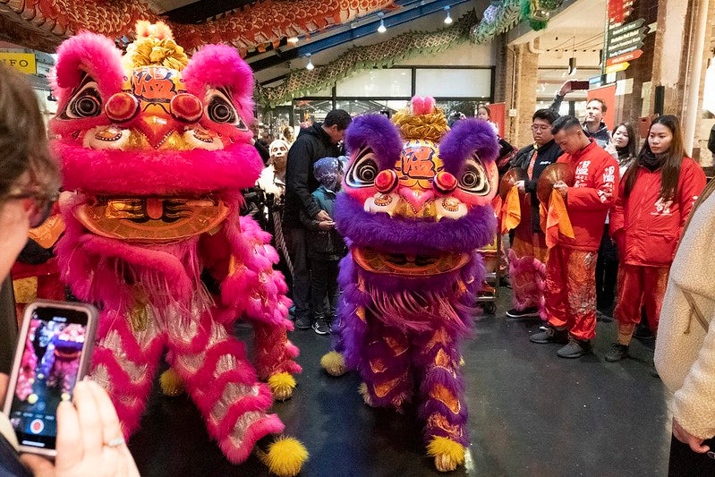 Lion dance performers on the main concourse of Chelsea Market
