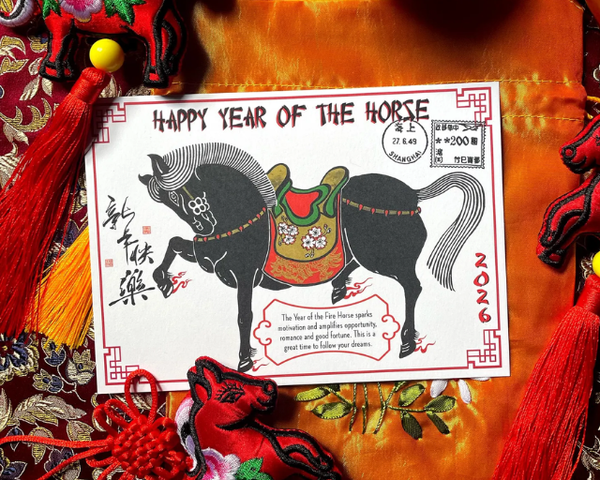 Card with Happy Year of the Horse wording and a black horse with a colorful saddle