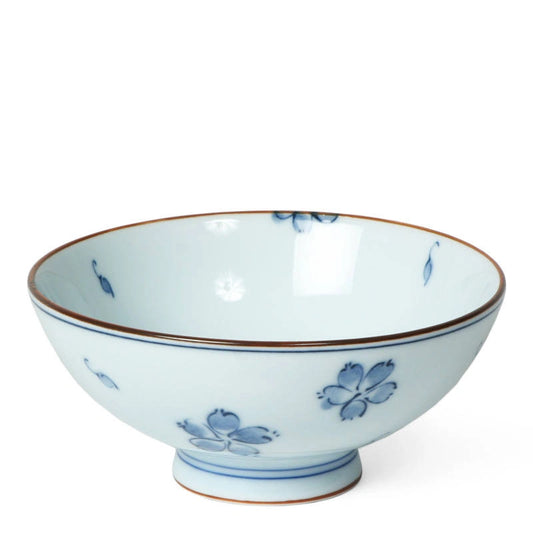 Ceramic bowl with blue floral patterns on a white background
