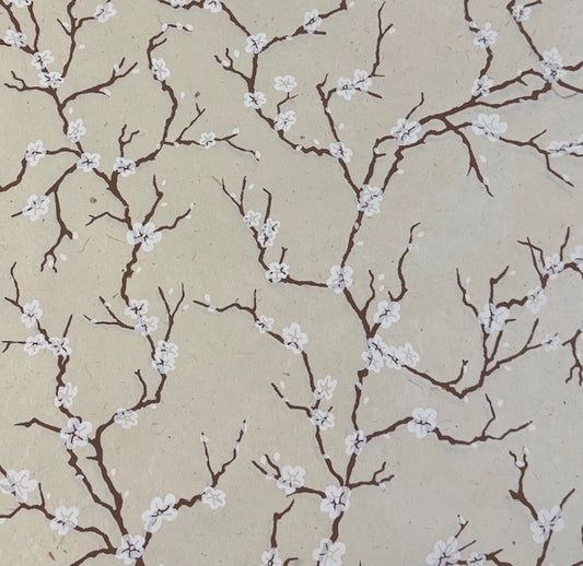 Beige wallpaper featuring a repeating pattern of dark brown branches with small white blossoms.