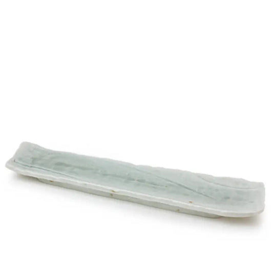 A long, narrow rectangular ceramic dish or tray with a pale celadon green glaze, shown on a plain white background.