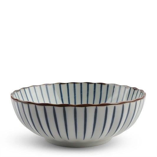 Ceramic bowl with a fluted edge, featuring vertical blue stripes on a white background. The rim is accented with a brown line. Simple and elegant design.