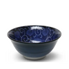 Blue ceramic bowl with floral patterns on a white background