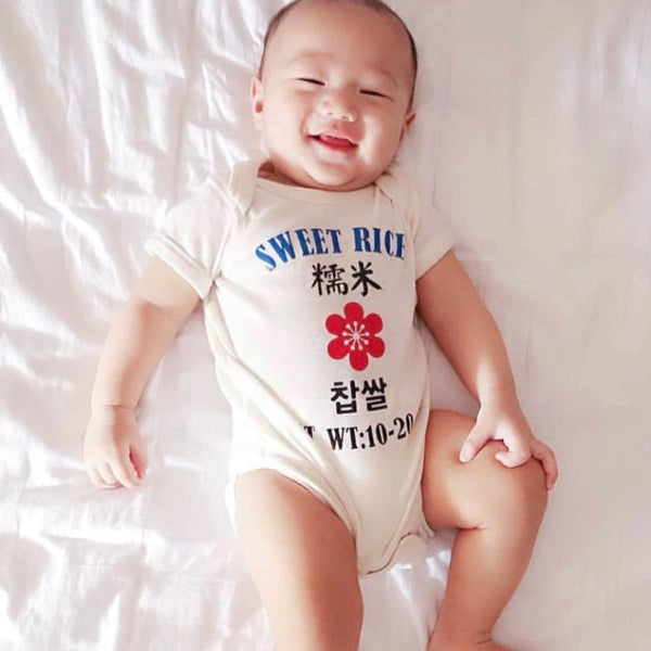 Baby wearing Sweet Rice Onesie
