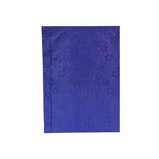 Blue notebook with floral pattern on a white background
