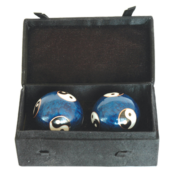 Two blue decorative balls with white patterns in a black box