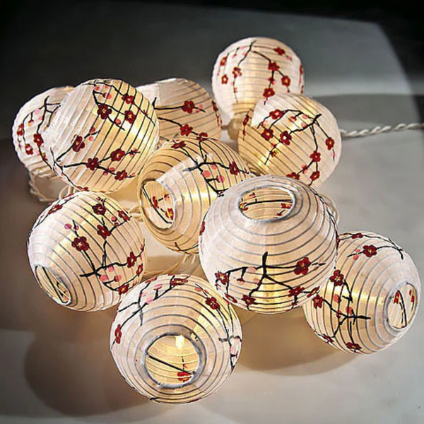 Pretty small white paper lanterns with red cherry blossoms