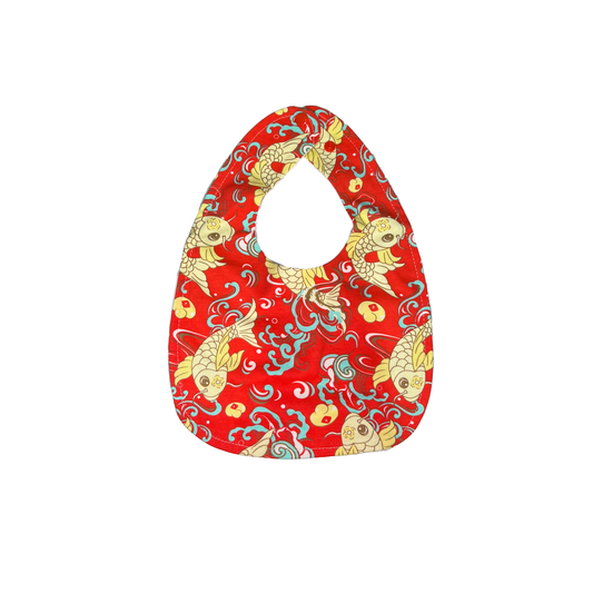 Red bib with goldfish pattern on a white background