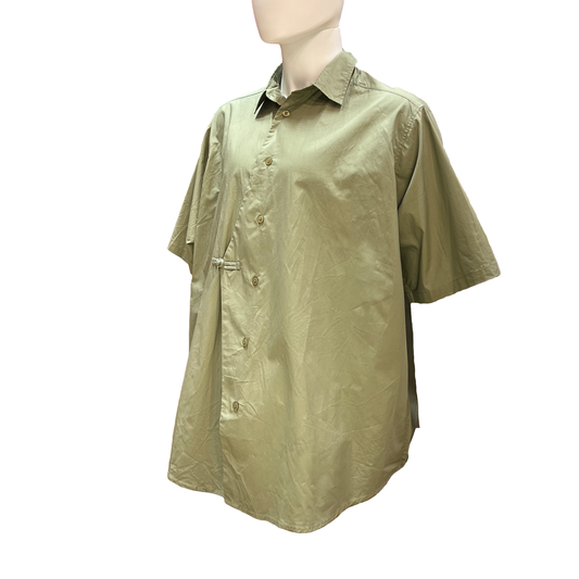 Green short sleeve shirt on mannequin