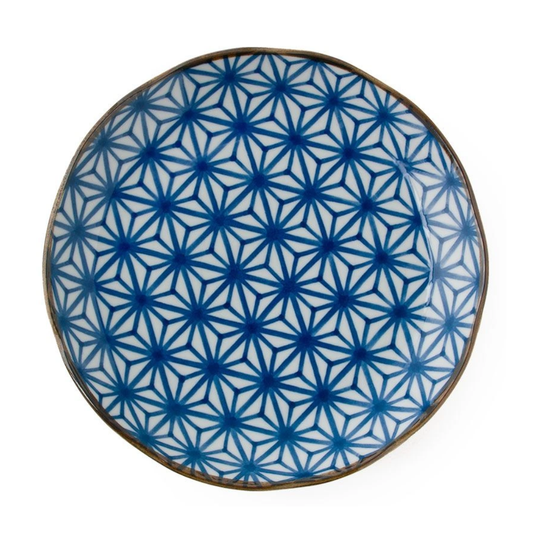 Ceramic plate with blue geometric pattern on a white background