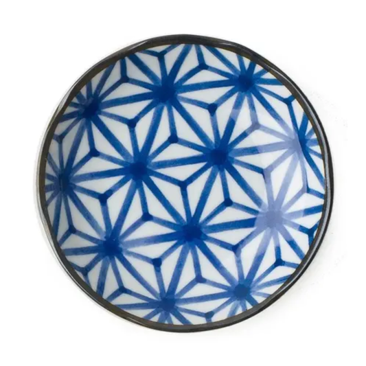 Ceramic plate with blue geometric pattern on a white background