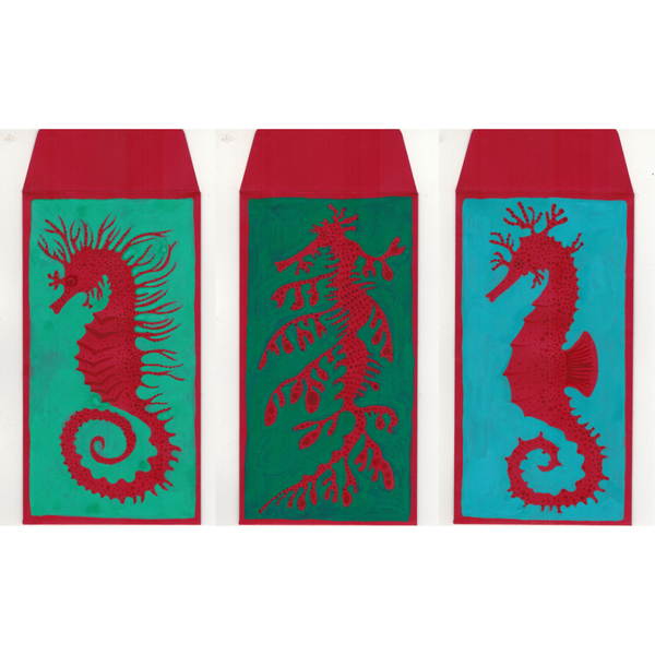 Three envelopes with red seahorse designs on teal backgrounds