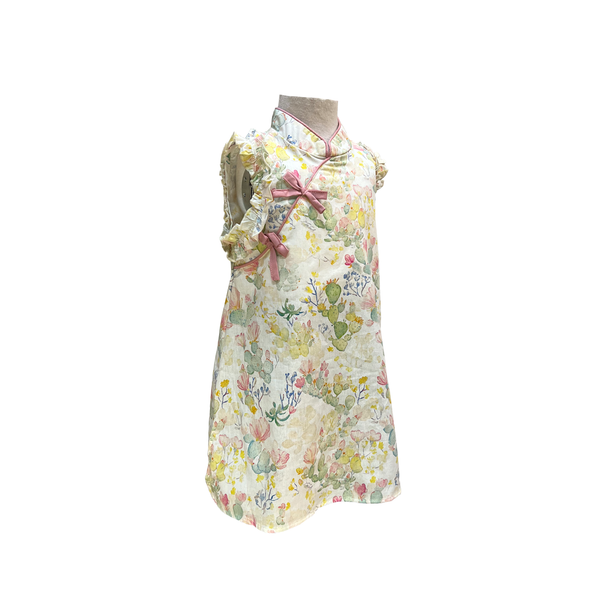 Floral dress on a mannequin against a white background