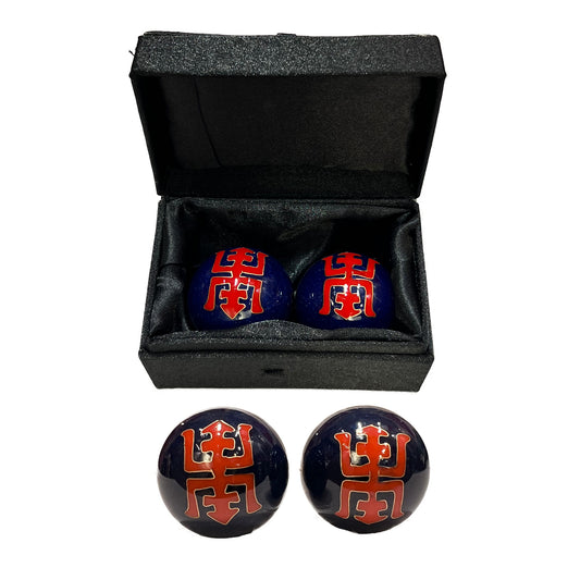 Black and red spherical objects with Chinese characters in a black box on a white background
