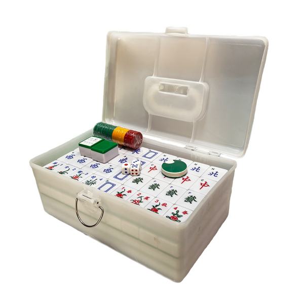 Open white mahjong set with tiles and dice on a white background