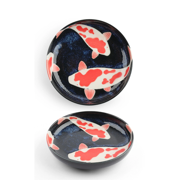 Two ceramic dishes with Koi fish design on a white background