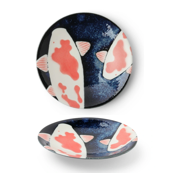 Ceramic plates with fish design on a white background