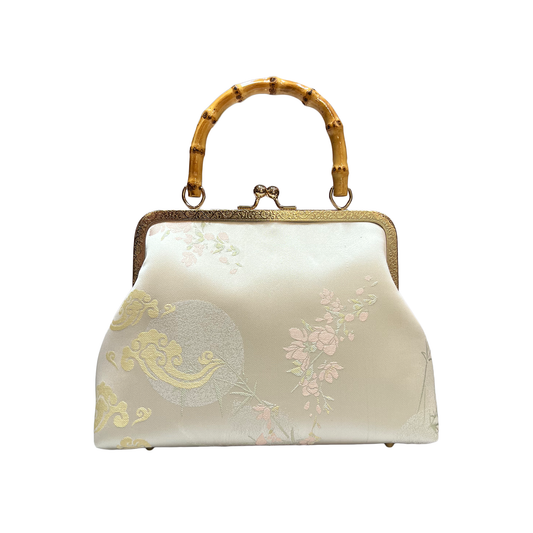 Pastel green purse with bamboo handle