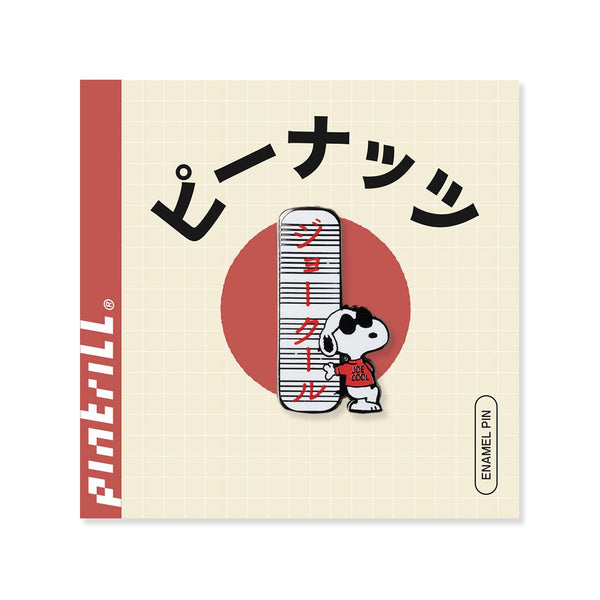 Enamel pin packaging with Snoopy and Japanese text on a beige background