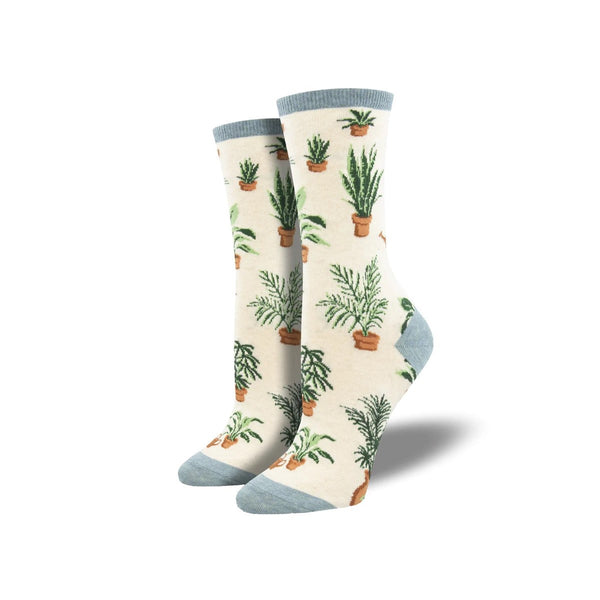 Ivory Heather socks with a bluish-gray cuff, heel, and toe. Different potted plants and a watering can patterns the sock.
