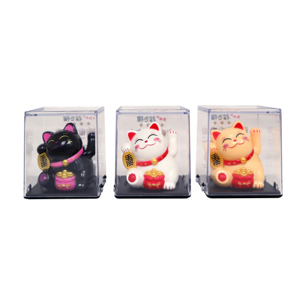 Solar Powered Hand Motion Lucky Cat in Clear Box in 3 colors. From left to right: black, white, and yellow