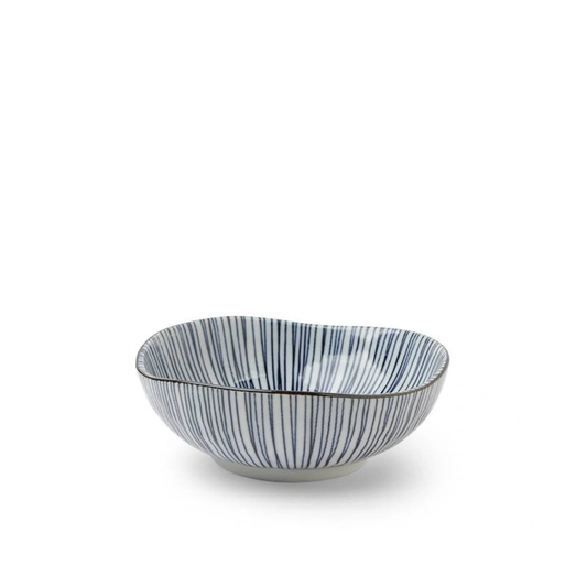 Ceramic bowl with blue and white striped pattern on a white background