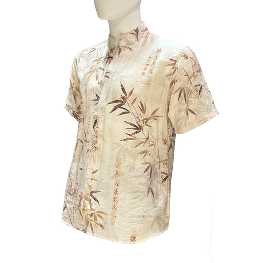 Beige shirt with bamboo pattern on a mannequin against a white background