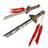 Decorative sword with ornate handle and red tassels on a white background