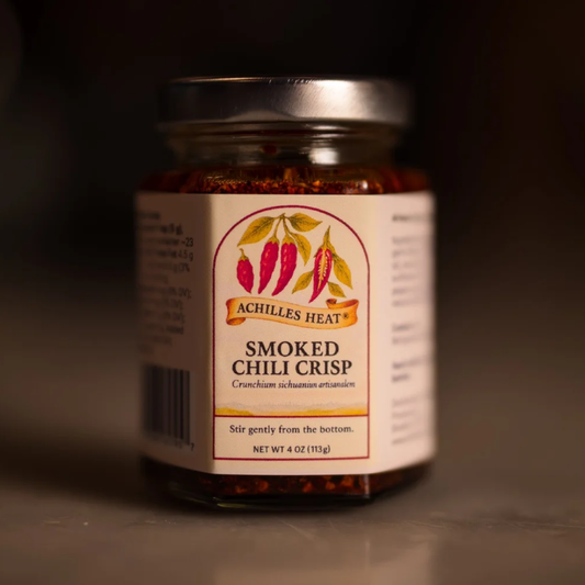 Jar of Achilles Heat Smoked Chili Crisp on a dark background