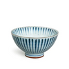 Ceramic bowl with blue vertical stripes on a white background