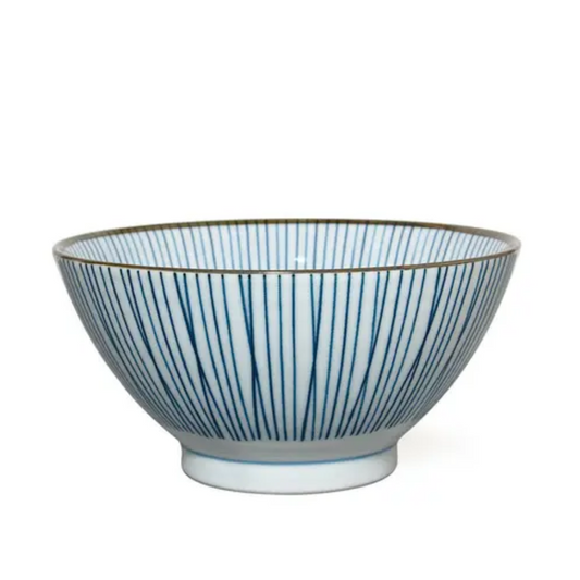 Ceramic bowl with blue vertical stripes on a white background