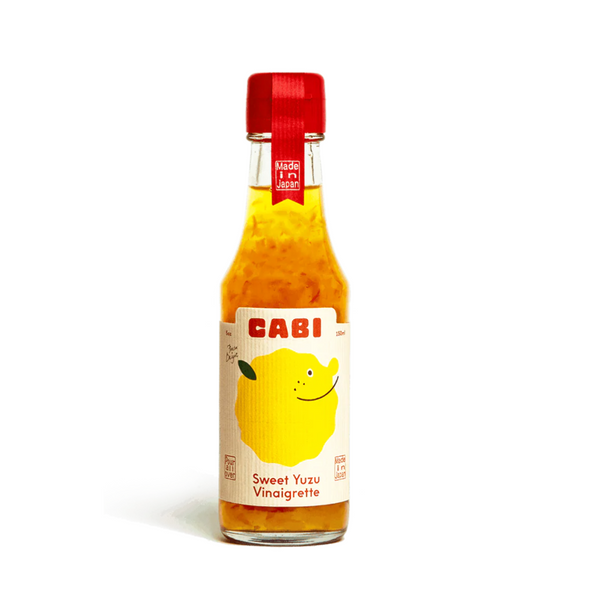 Bottle of CABI Sweet Yuzu Vinaigrette on a white background