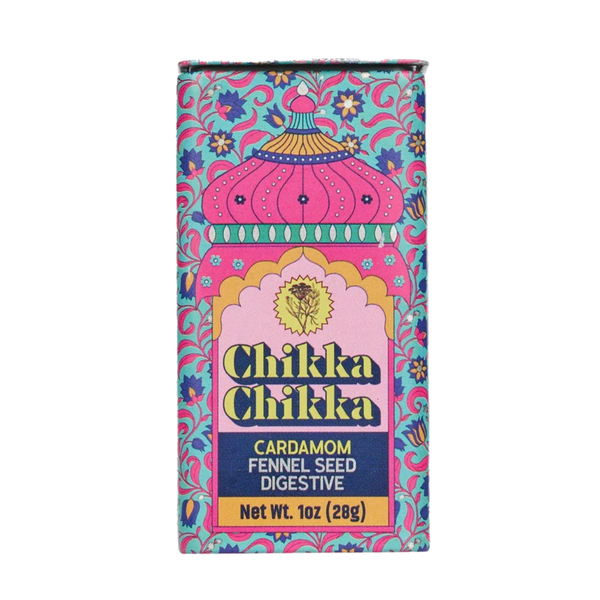 A rectangular box of Chikka Chikka Cardamom Fennel Seed Digestive, featuring a vibrant pink and turquoise patterned design with a central pink arch and yellow text.