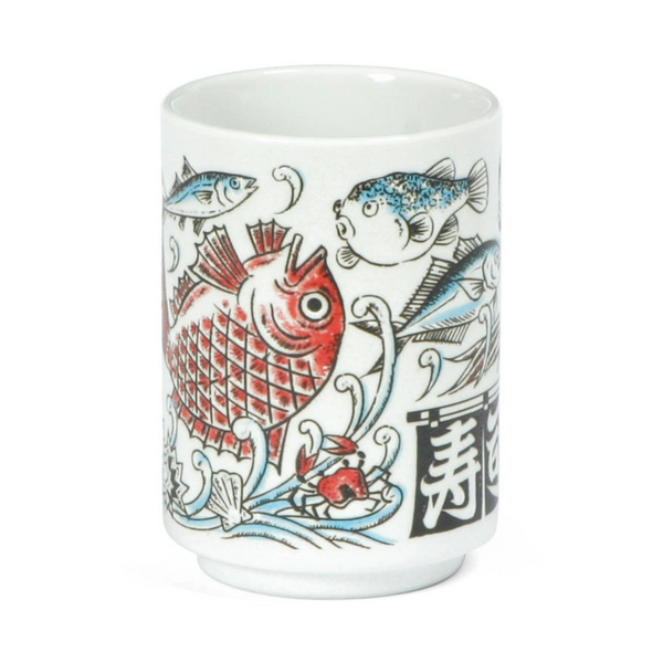 Ceramic tea cup with fish and wave design on a white background