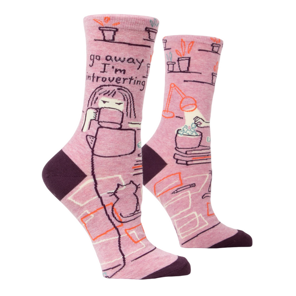 Pink socks with text and cartoon character drinking coffee