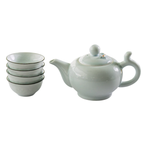 Ceramic teapot and bowls on a white background