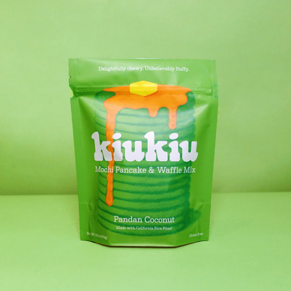 Green package of kiukiu Mochi Pancake & Waffle Mix on a green background