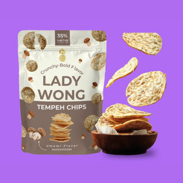 Lady Wong Tempeh chips bag next to a bowl of its chips falling into a bowl
