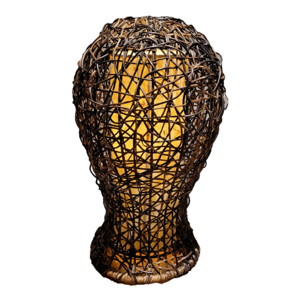 Woven rattan lamp shaped like a head on a white background